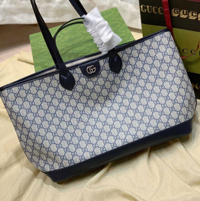 G*u*i shopping bags